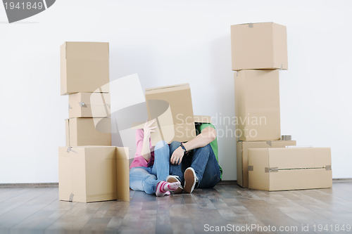 Image of Young couple moving in new house