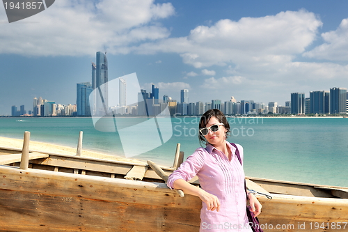 Image of happy tourist woman