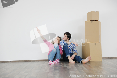 Image of Young couple moving in new house