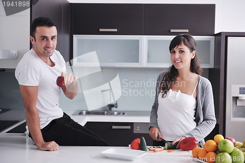 Image of young couple have fun in modern kitchen