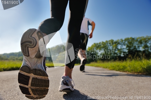 Image of Young couple jogging