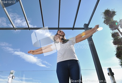 Image of couple relaxing on balcony