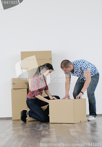 Image of Young couple moving in new house