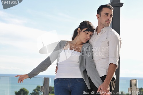Image of couple relaxing on balcony
