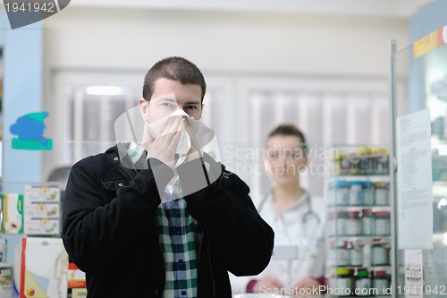 Image of pharmacist suggesting medical drug to buyer in pharmacy drugstor