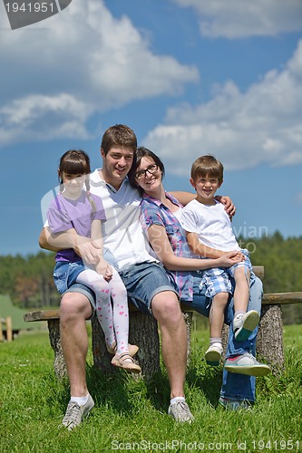 Image of happy young family have fun outdoors