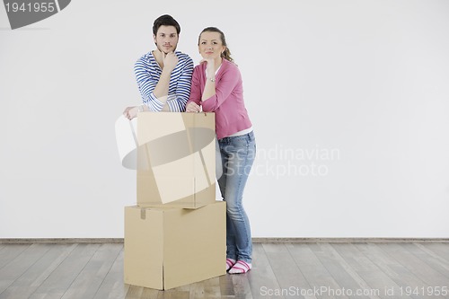 Image of Young couple moving in new home