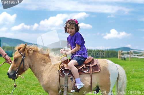 Image of child ride pony