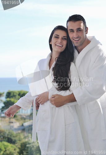 Image of couple relaxing on balcony