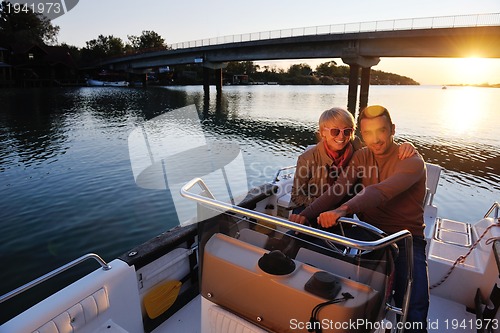 Image of couple in love  have romantic time on boat