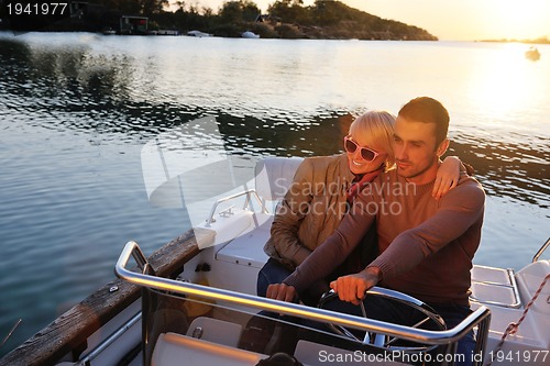 Image of couple in love  have romantic time on boat