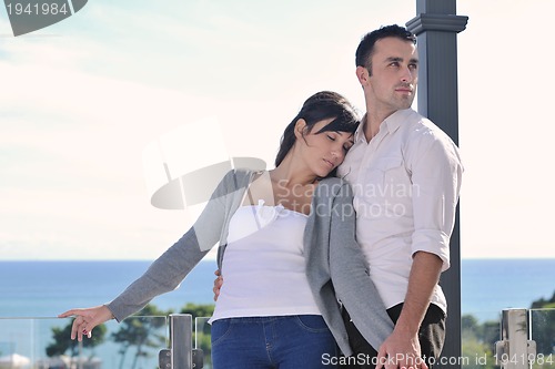 Image of couple relaxing on balcony