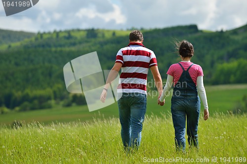 Image of romantic young couple in love together outdoor