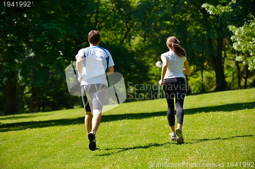 Image of Young couple jogging