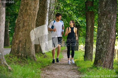 Image of Young couple jogging