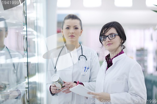 Image of team of pharmacist chemist woman  in pharmacy drugstore