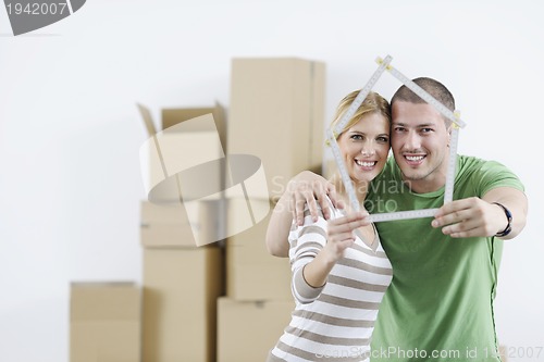 Image of Young couple moving in new home