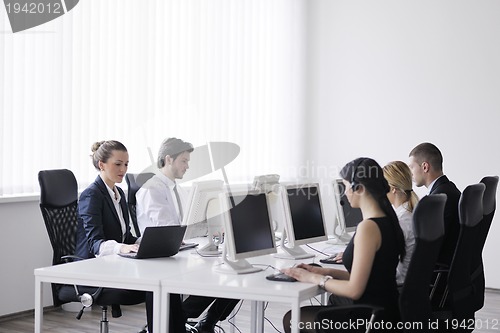 Image of business people group working in customer and help desk office