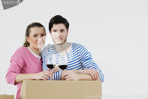 Image of Young couple moving in new house