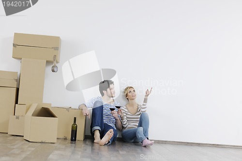 Image of Young couple moving in new home