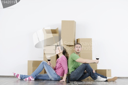 Image of Young couple moving in new home