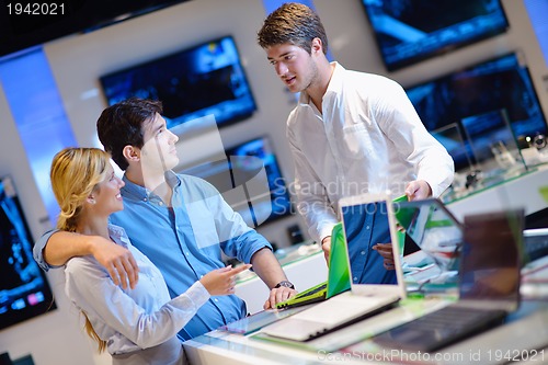 Image of people buy  in consumer electronics store