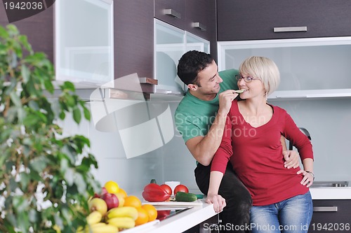 Image of young couple have fun in modern kitchen