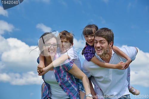 Image of happy young family have fun outdoors