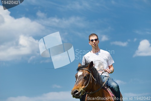 Image of man ride horse