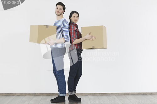 Image of Young couple moving in new home