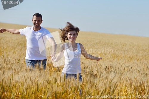 Image of happy couple in wheat field