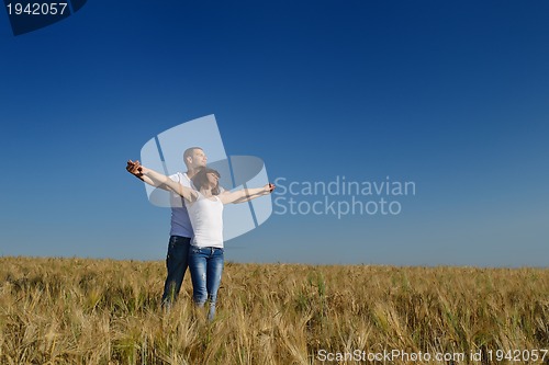 Image of happy couple in wheat field
