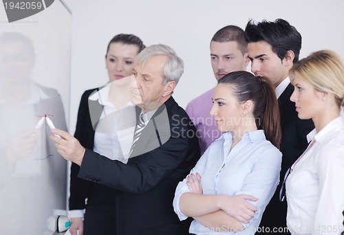 Image of Senior business man giving a presentation