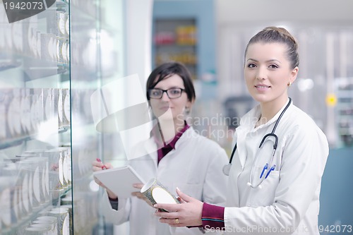 Image of team of pharmacist chemist woman  in pharmacy drugstore