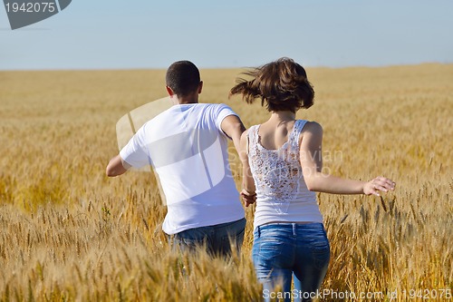 Image of happy couple in wheat field