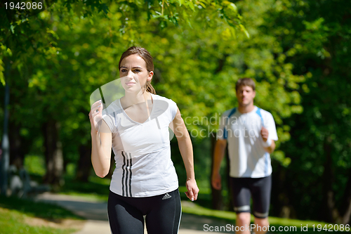 Image of Young couple jogging