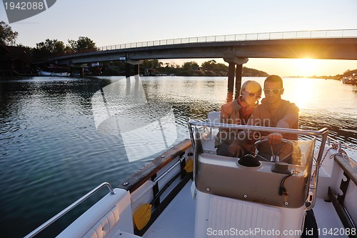 Image of couple in love  have romantic time on boat