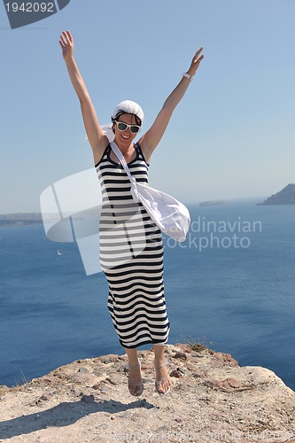 Image of Greek woman on the streets of Oia, Santorini, Greece