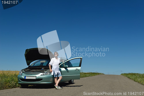 Image of woman with broken car