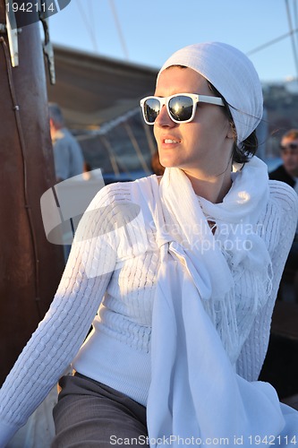 Image of Greek woman on the streets of Oia, Santorini, Greece