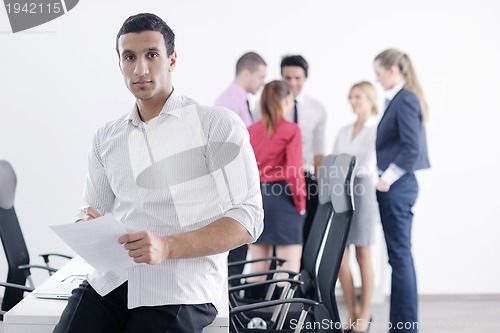 Image of young business man at meeting