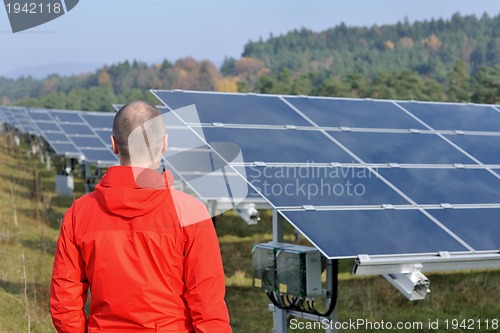 Image of Male solar panel engineer at work place