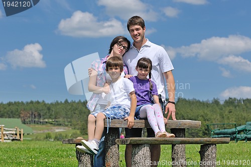 Image of happy young family have fun outdoors