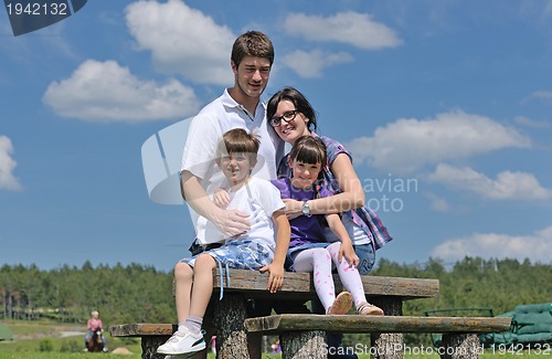 Image of happy young family have fun outdoors