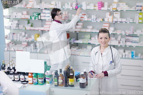 Image of team of pharmacist chemist woman  in pharmacy drugstore