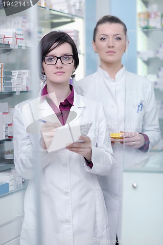 Image of team of pharmacist chemist woman  in pharmacy drugstore