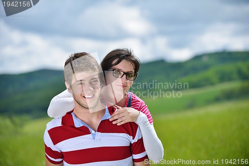 Image of romantic young couple in love together outdoor