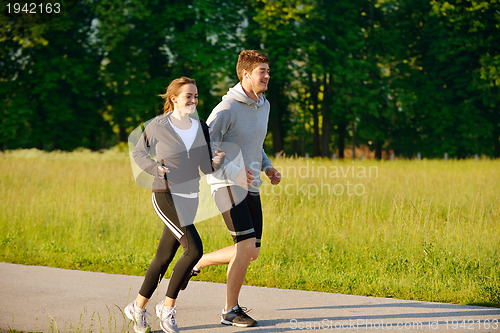 Image of Young couple jogging