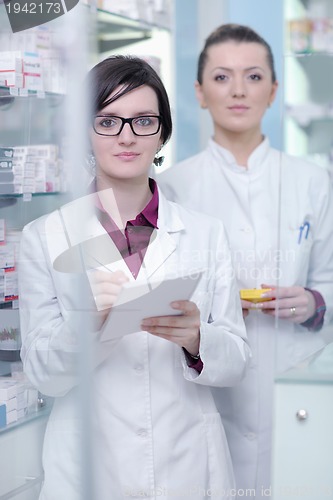 Image of team of pharmacist chemist woman  in pharmacy drugstore