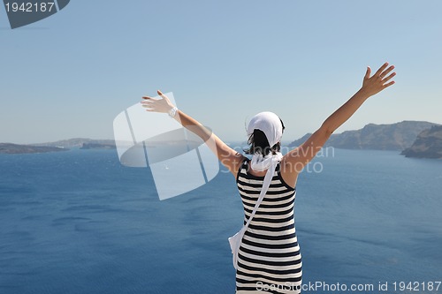 Image of Greek woman on the streets of Oia, Santorini, Greece